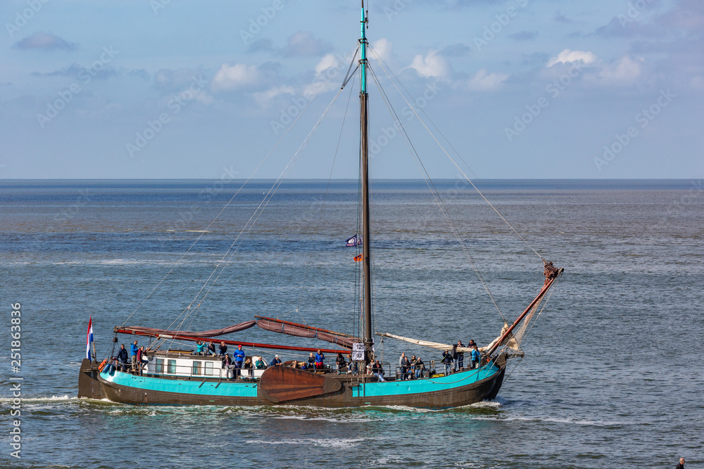 Antique sailboats on the Dutch Waddensea on a sunny day Antique sailboats on the Dutch Waddensea on a sunny day