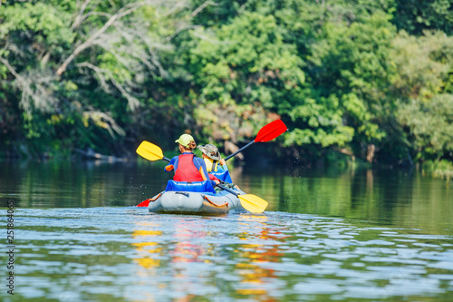 Wallpaper Mural Happy kids kayaking on the river on a sunny day during summer vacation Torontodigital.ca