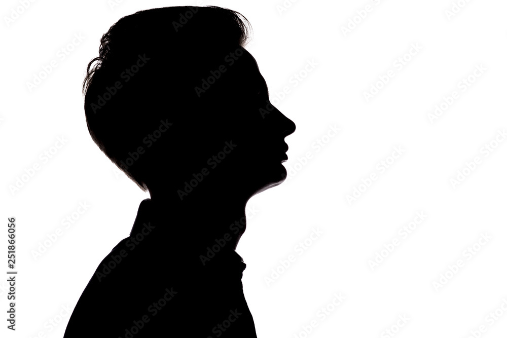 horizontal black and white silhouette portrait of an unrecognizable guy thoughtfully looking up,young man face profile on a white isolated background
