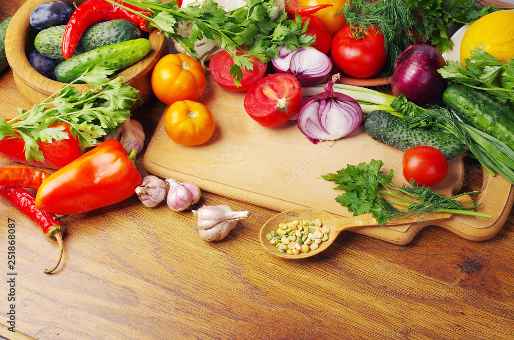 A variety of vegetables on the kitchen board. A variety of vegetables on the kitchen board.