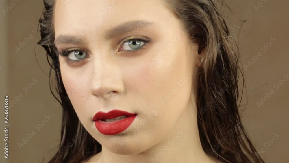 Portrait of a cute girl with professional make-up and beautiful lips close-up Portrait of a cute girl with professional make-up and beautiful lips close-up