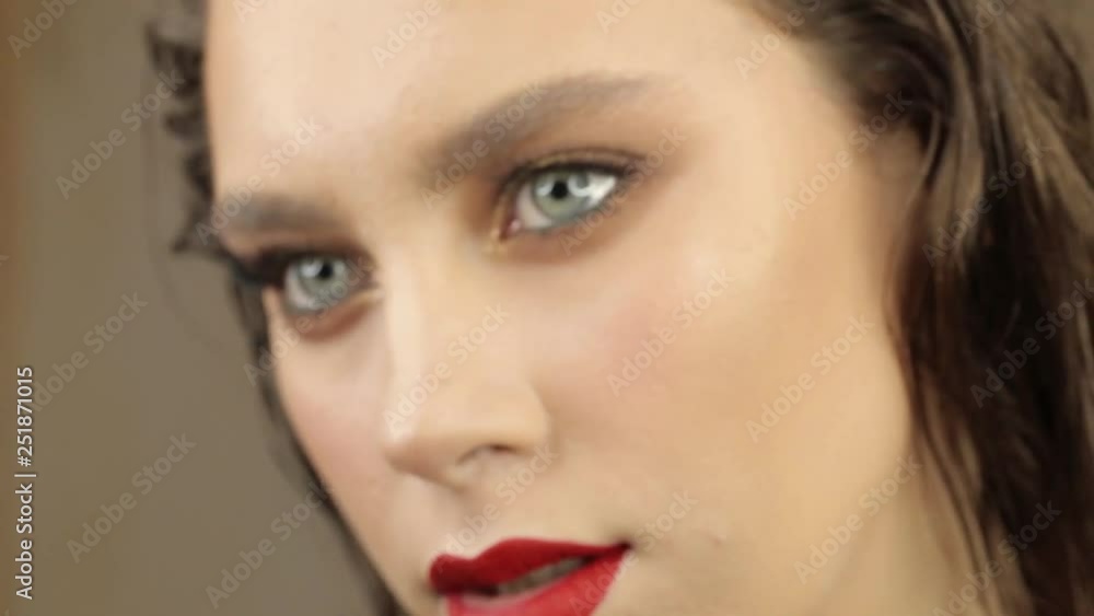Portrait of a cute girl with professional make-up and beautiful lips close-up Portrait of a cute girl with professional make-up and beautiful lips close-up