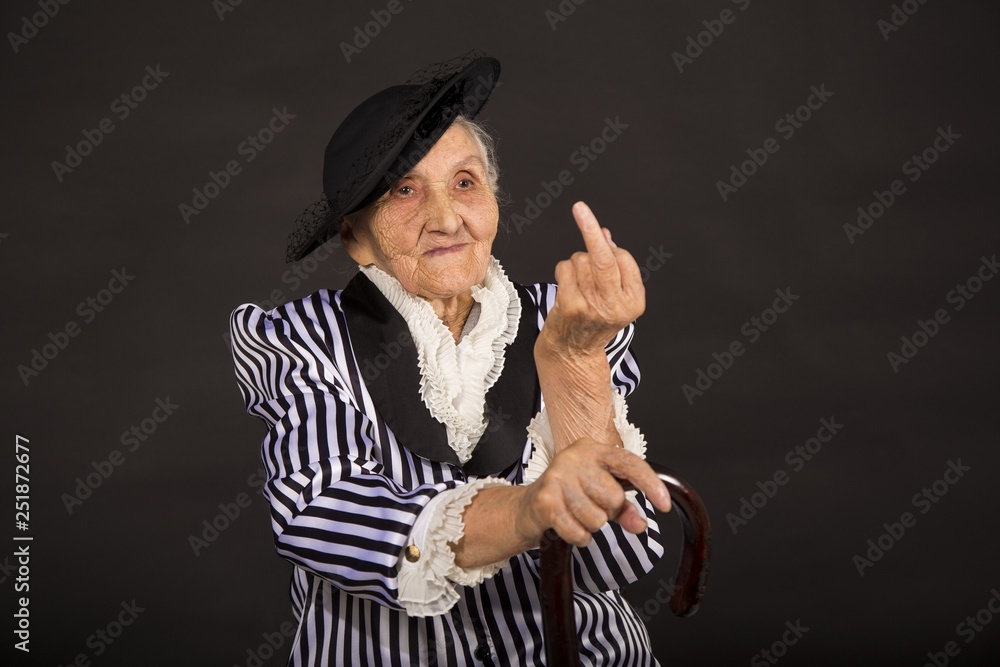 Old grandma in a white-black striped jacket Stock-Foto | Adobe Stock