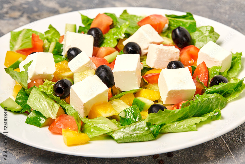 Geek salad on table with freesh vegetables. Geek salad on table with freesh vegetables.