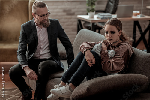 Businessman coming to her teenage daughter with depression