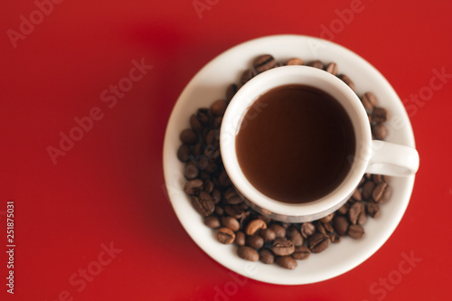 top view cup of black coffee on a red background copy space