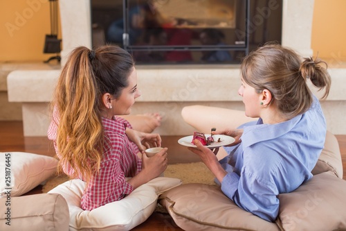 Women chitchatting with best friend at home