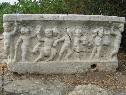 Ancient Greek bath with bas-relief photo