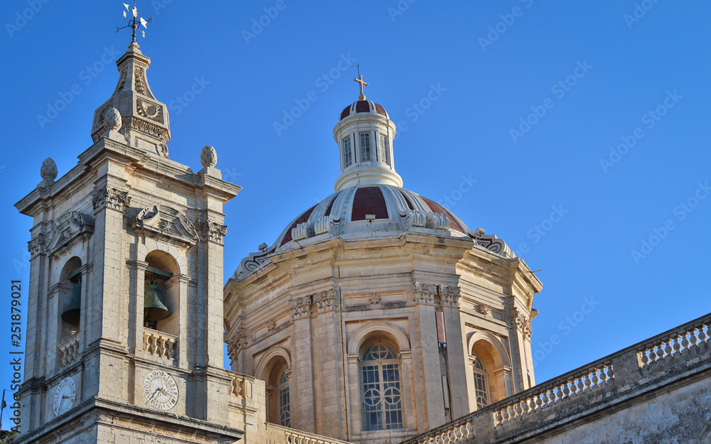 The beautiful couple of old St. Paul's Church with bells and so many details in rabat, malta on a sunny day. Rabat, Malta. Europe