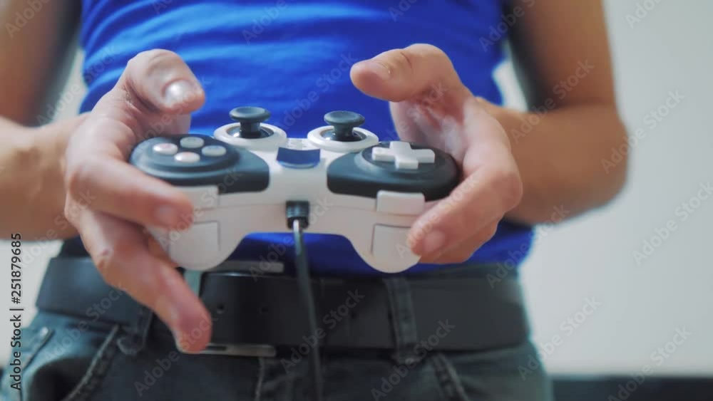man concept playing gamepad hands video console on tv. Hand hold new joystick playing video console on tv. Gamer play game with gamepad controller. Gaming man holding lifestyle simulator joypad man concept playing gamepad hands video console on tv. Hand hold new joystick playing video console on tv. Gamer play game with gamepad controller. Gaming man holding lifestyle simulator joypad