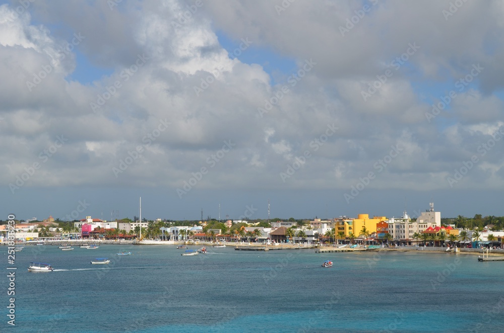 boats on the shore of cozumel
