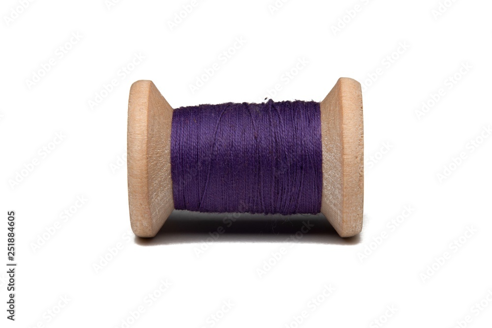 Wooden coil with thread on a white isolated background Wooden coil with thread on a white isolated background