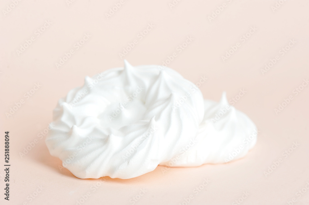 Meringues on a light background. Close-up. Macro shooting. Meringues on a light background. Close-up. Macro shooting.