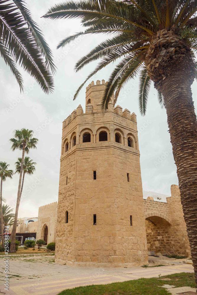 The tower surrounded by palm trees at the entrance to Medina. Tunisia, Monastir