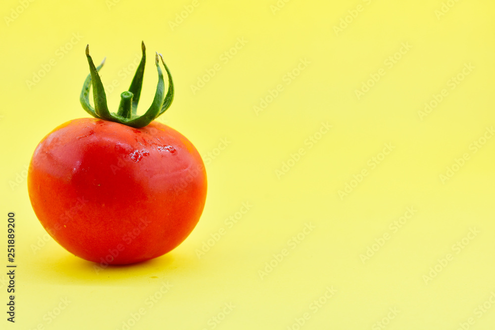 Tomatoes on yellow background Tomatoes on yellow background