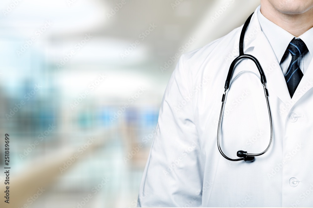 Young man doctor holding stethoscope Young man doctor holding stethoscope