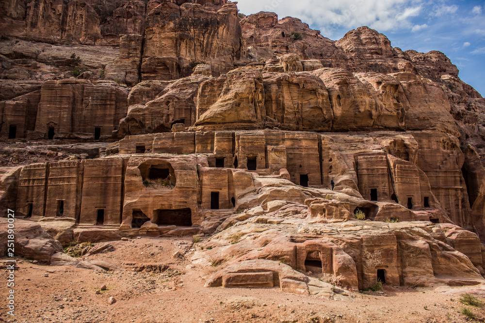 ancient archeological Middle East Arabic city inside desert steep rocks bare mountain environment 