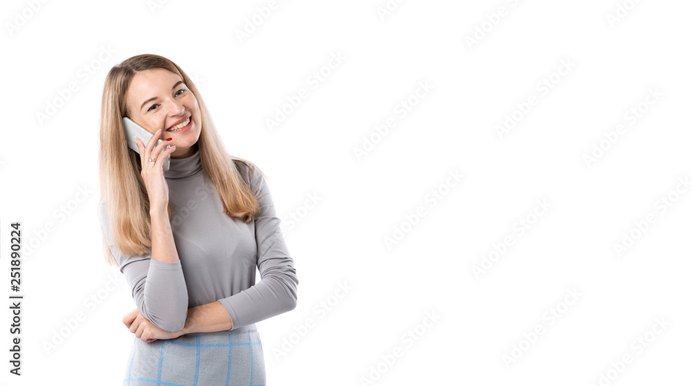 The theme of a business woman and telephone conversations. Beautiful young caucasian woman uses a smartphone handset to call in formal clothes on a white isolate background The theme of a business woman and telephone conversations. Beautiful young caucasian woman uses a smartphone handset to call in formal clothes on a white isolate background