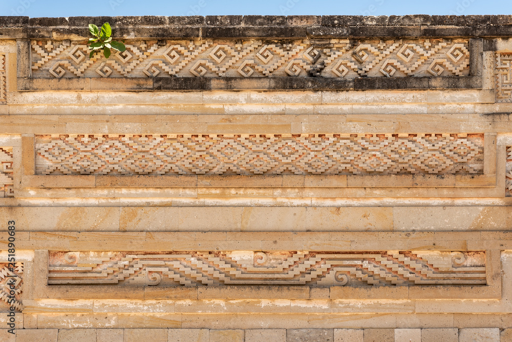 Elaborate fretwork found in old ruins in Oaxaca, Mexico. Intricate stone detail found in the archaeological site of Mitla