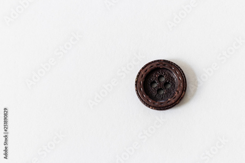 close up on button, white background