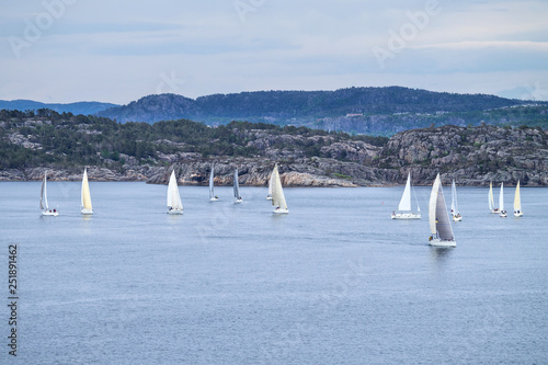 sailboats in Norwegian fjord landscape