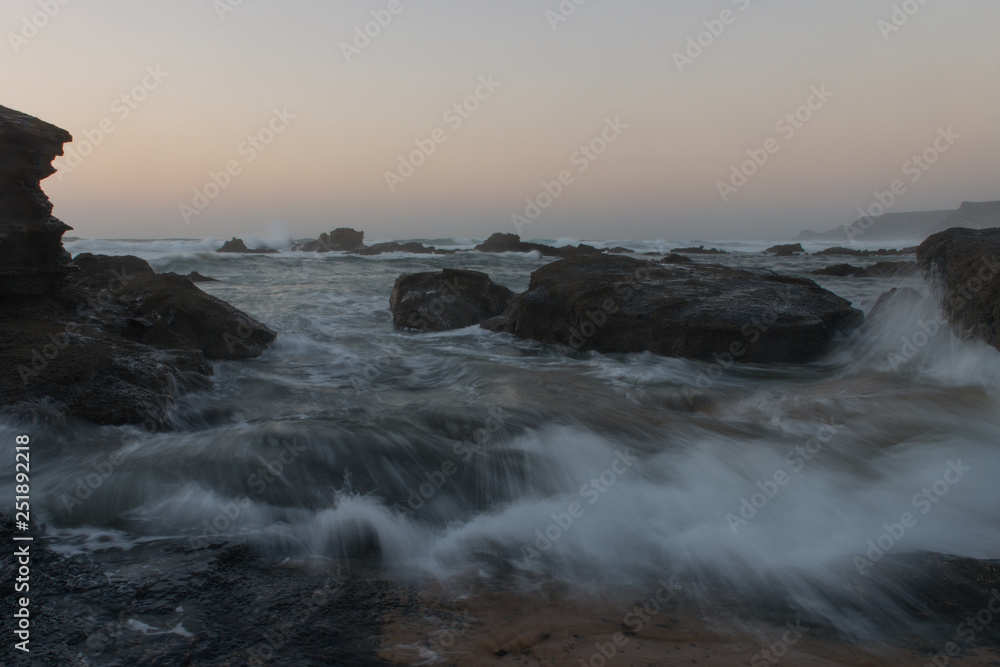 The power of ocean waves and portuguese rocky coast from Lagos, Algarve The power of ocean waves and portuguese rocky coast from Lagos, Algarve