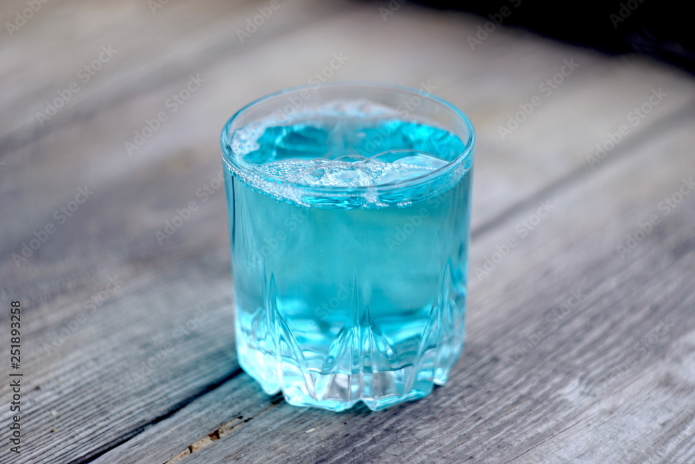 glass with blue liquid