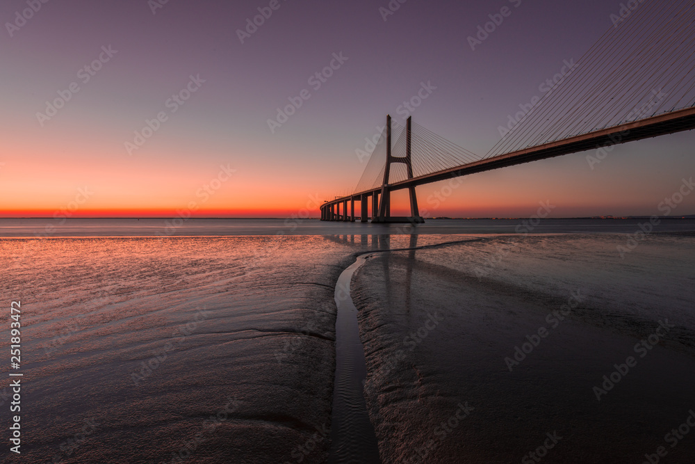 Peaceful atmosphere at Vasco de Gama Bridge in Lisbon during sunrise. Ponte Vasco de Gama, Lisboa, Portugal