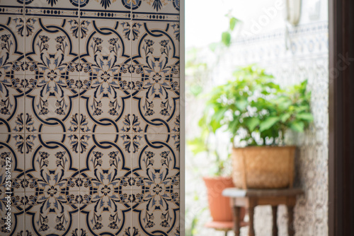 Azulejos Portuguese exterior wall tiles in Tavira, Portugal. Traditional decorative azulejos wall ceramic tiles.