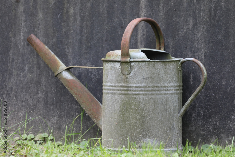 close-up view of watering can at municipal cemetery in Amsterdam, The Netherlands close-up view of watering can at municipal cemetery in Amsterdam, The Netherlands