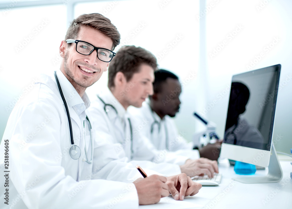group of doctors conducting laboratory studies group of doctors conducting laboratory studies