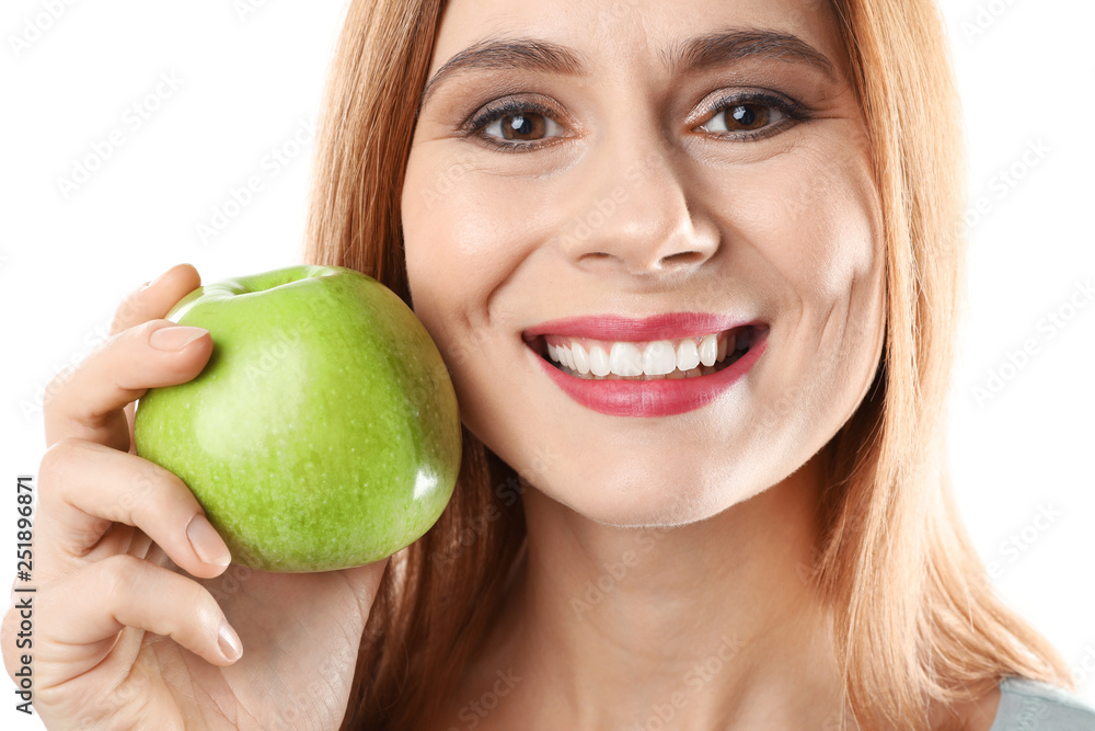 Smiling woman with perfect teeth and green apple on white background, closeup Smiling woman with perfect teeth and green apple on white background, closeup
