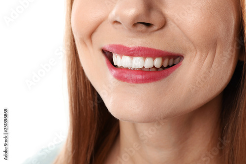 Smiling woman with perfect teeth on white background  closeup