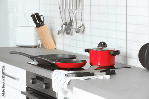 Different clean cookware and utensils in kitchen