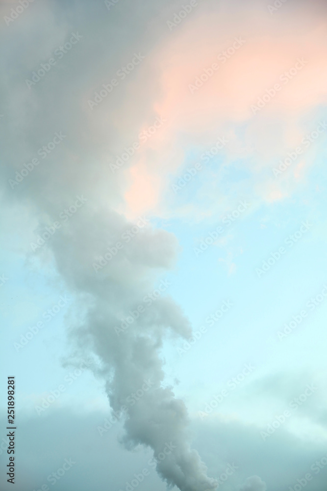 Colorful sky with clouds and steam pipe jet Colorful sky with clouds and steam pipe jet