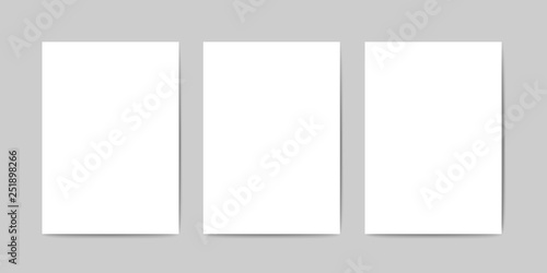 Three blank A4 sheets vector template. Realistic A4 paper on a gray surface with a realistic shadows. Vector card template. A white empty sheets (A4) of paper. Perfect vector mockup for your design.
