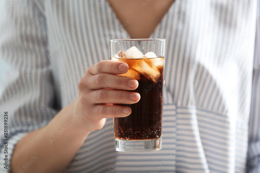Woman with glass of cold cola, closeup Woman with glass of cold cola, closeup