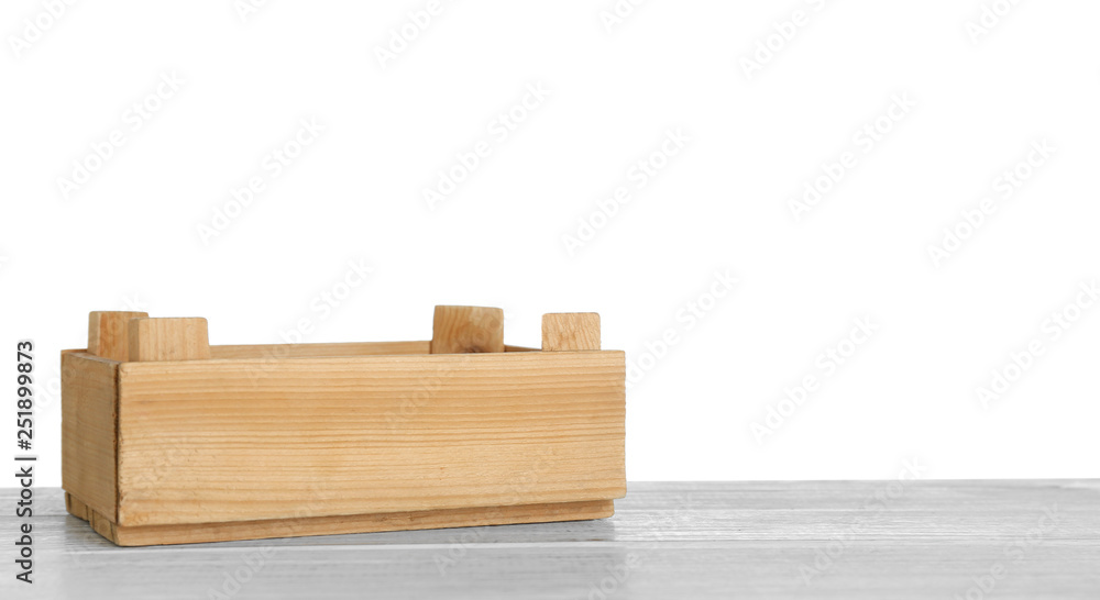 Empty rustic wooden crate on table against white background. Space for text
