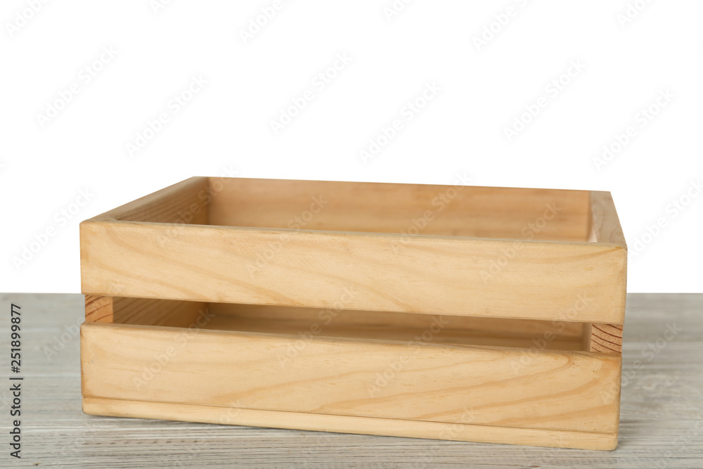 Empty rustic wooden crate on table against white background Empty rustic wooden crate on table against white background