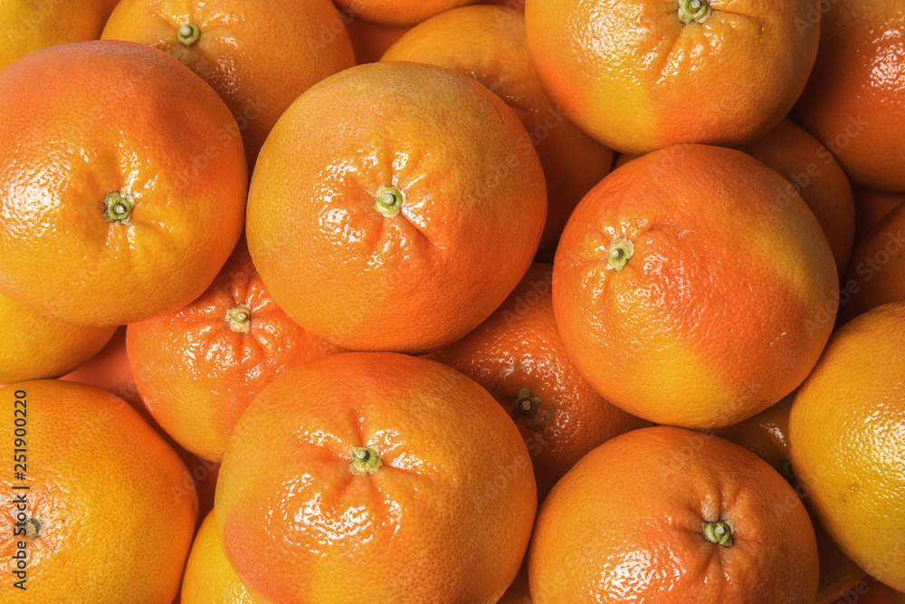 Many whole fresh ripe grapefruits as background, top view Many whole fresh ripe grapefruits as background, top view