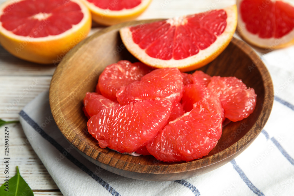 Plate with fresh peeled grapefruit on table Plate with fresh peeled grapefruit on table
