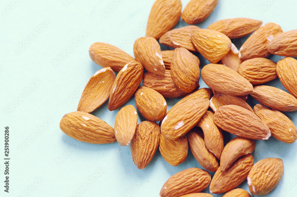 Fototapeta premium A handful of organic raw almonds. Healthy food. Raw food for vegans.