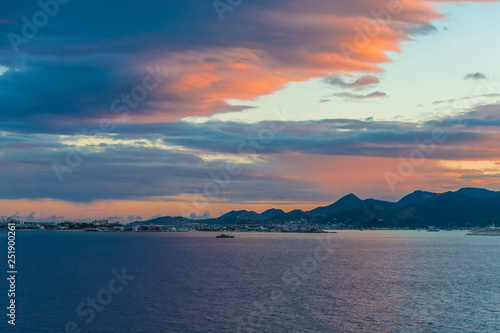 Fototapeta Naklejka Na Ścianę i Meble -  Hills and Ships Against a Tropical Sunrise in the Caribbean