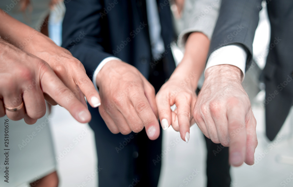 close up. business team pointing at you close up. business team pointing at you