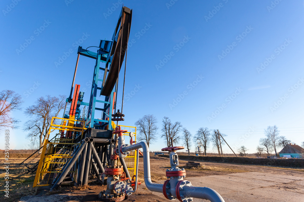 close-up of a sunlit oil extracting tower during operation close-up of a sunlit oil extracting tower during operation