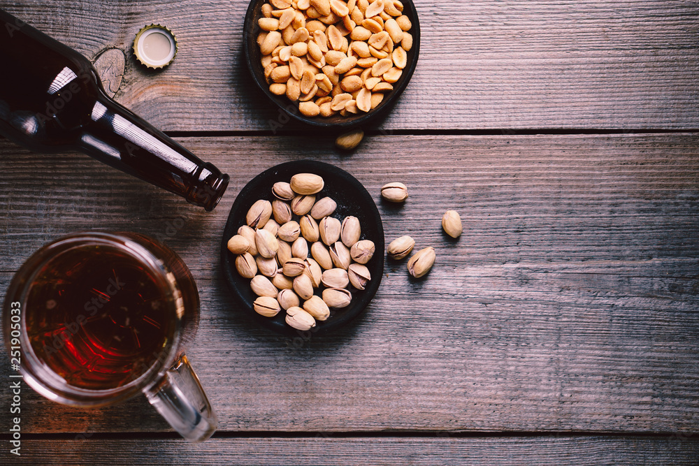 beer and snacks. friday party atmosphere, craft brewery, bar table. restaurant, pub, food concept. delicious lager drink and salted nuts beer and snacks. friday party atmosphere, craft brewery, bar table. restaurant, pub, food concept. delicious lager drink and salted nuts