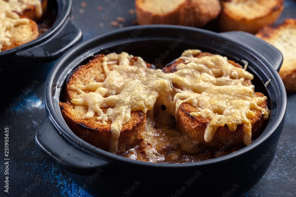 Delicious onion soup with croutons and cheese Delicious onion soup with croutons and cheese