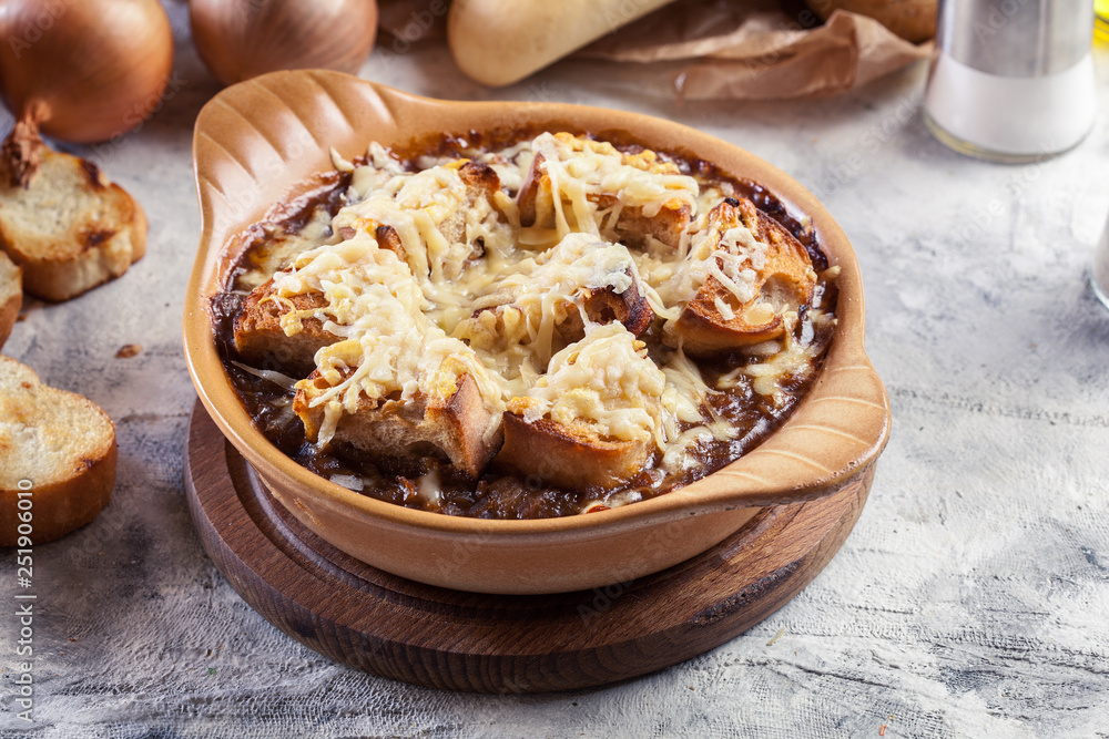 Delicious onion soup with croutons and cheese Delicious onion soup with croutons and cheese