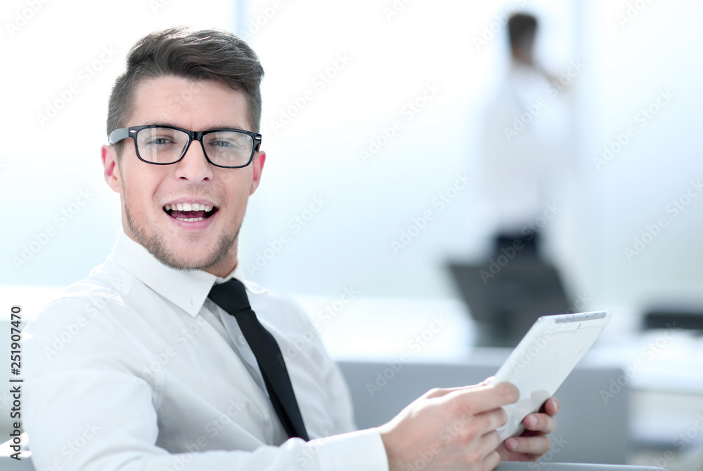 Attractive businessman working with tablet and touching digital display Attractive businessman working with tablet and touching digital display
