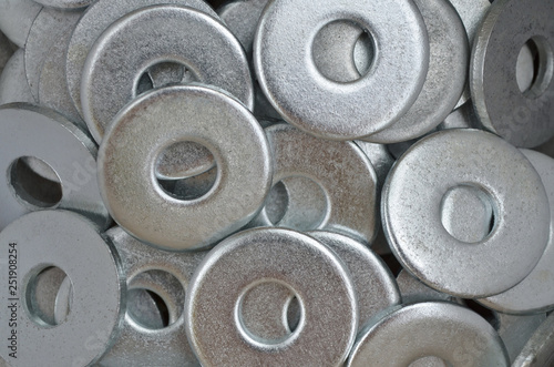 Metal fasteners. Many washers for construction as an industrial style background, close-up.